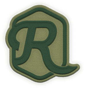 A green and olive embroidered patch features a stylized letter “R” inside an irregular hexagonal border—perfect for fans of New Homes DFW or those seeking unique accents for lake homes North Dallas.