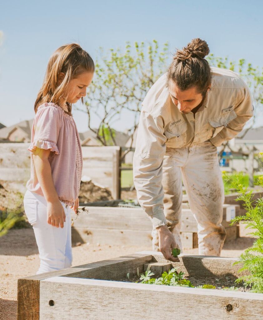 A girl learning about gardening.